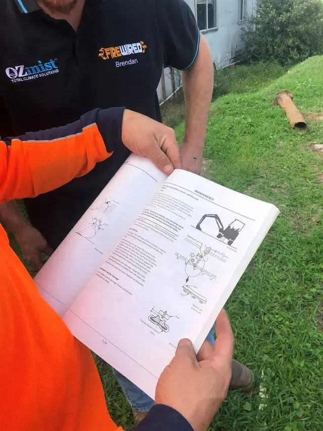 Man Reading Books — Statement of Attainment Central Coast