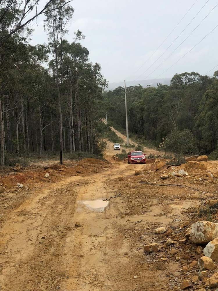 Two Cars Moving on Dirt Road — Plant & Machinery Training in the Hunter Region