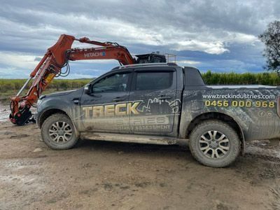 Work Ute With Excavator in the Background — Statement of Attainment Maitland