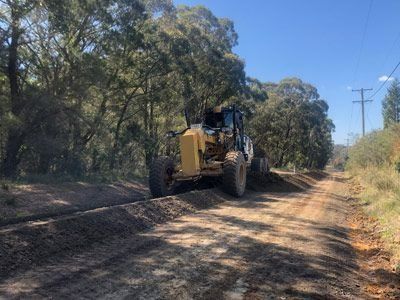 A tractor driving on a dirt road — Verification of Competency Maitland