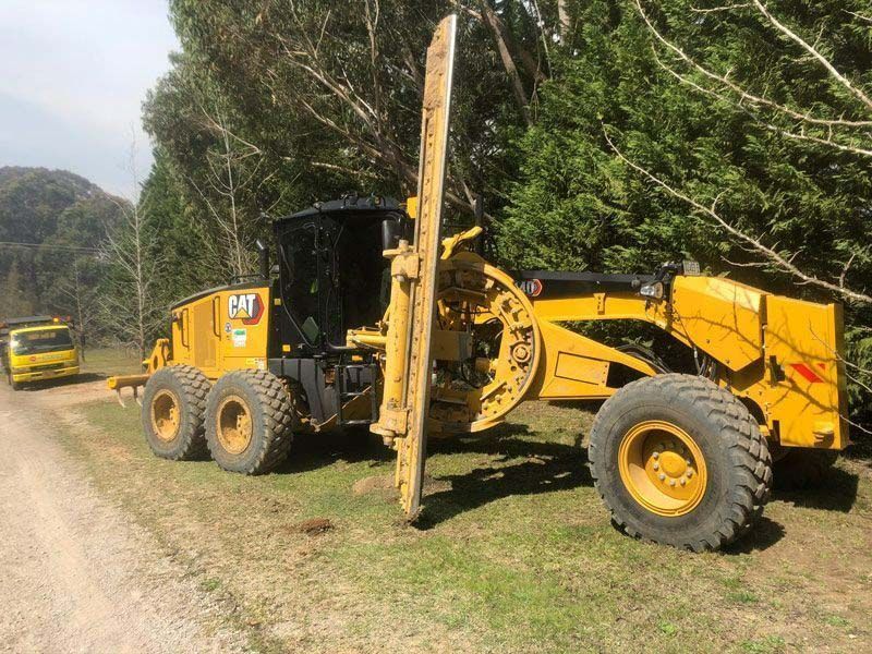 Yellow Heavy Machinery Parked Beside Some Trees — Plant Operator Courses Near Me In Australia