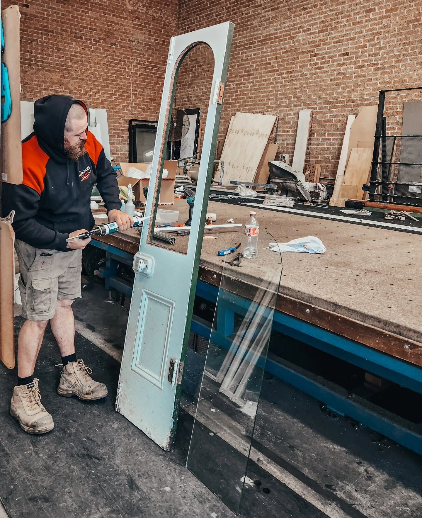 Man Working on Glass Repair in Wollongong