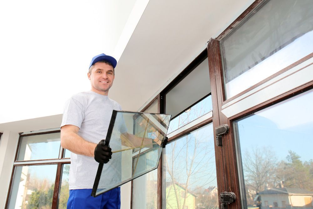 Glazier Replacing Glass Windows of A Residential House