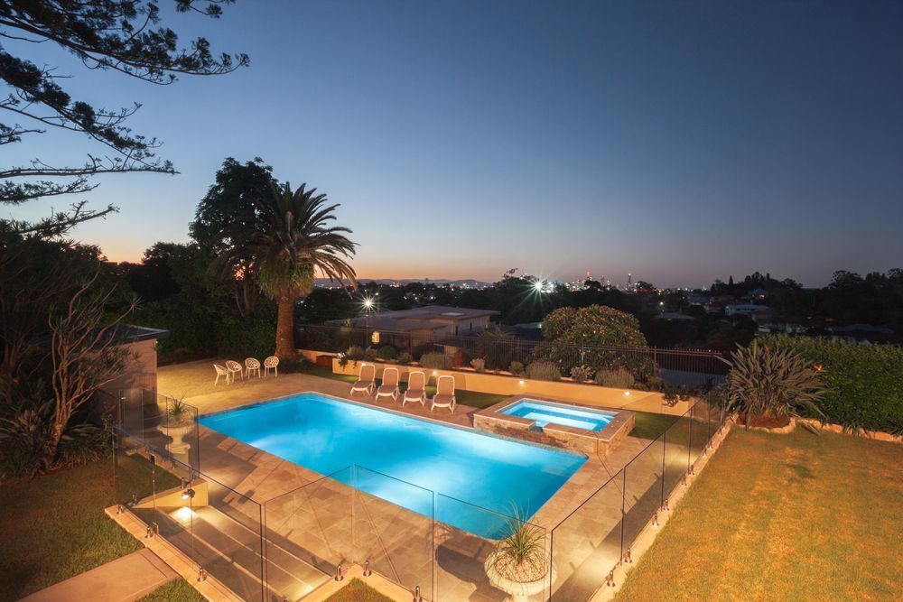 Pool With Glass Fence At Night