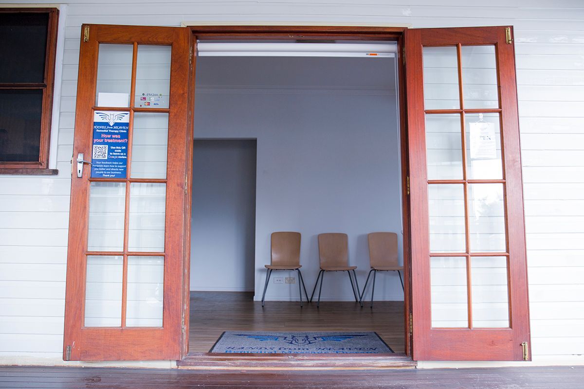 A Door That Is Open To A Room With Chairs In It – Chermside, QLD - Hands From Heaven Remedial Therapy Clinic