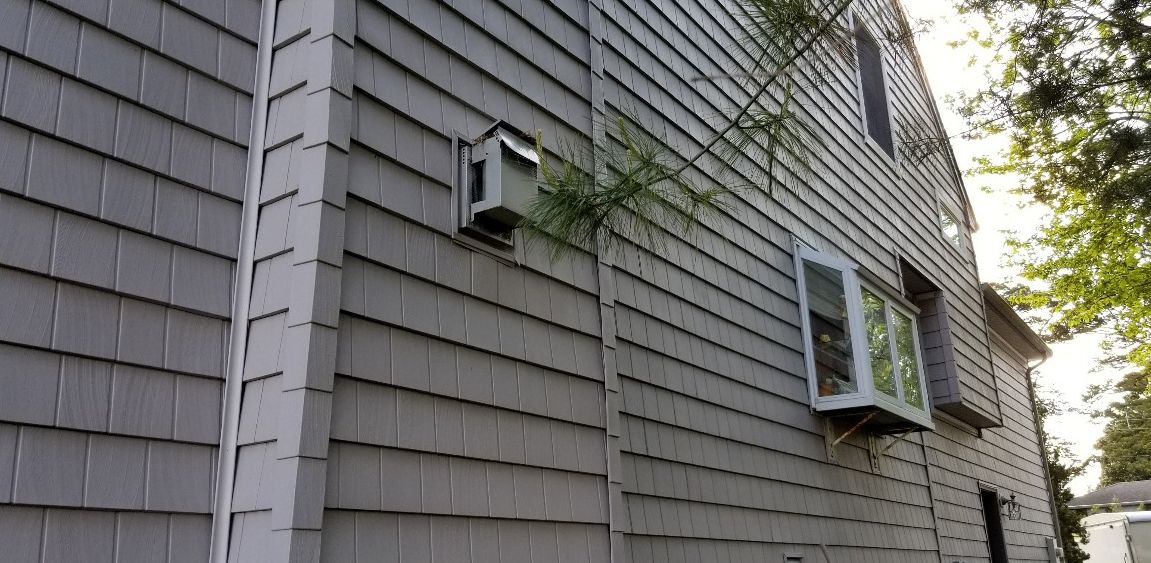Power washing a house