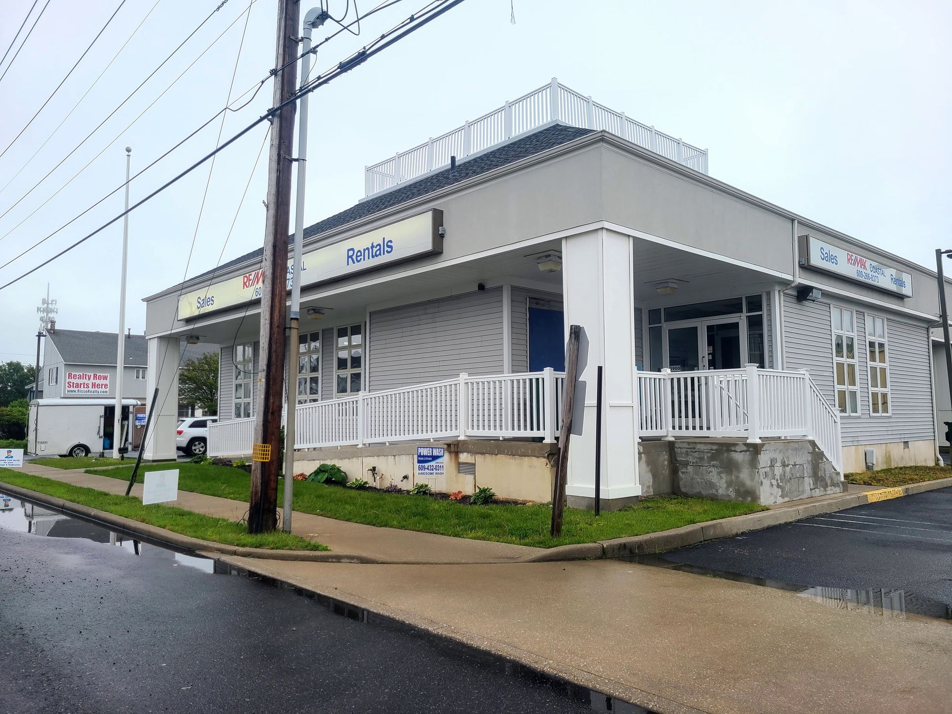 Pressure washing siding of house