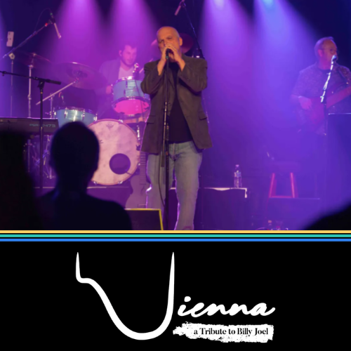 Live band performing onstage under purple lights, with singer at center and