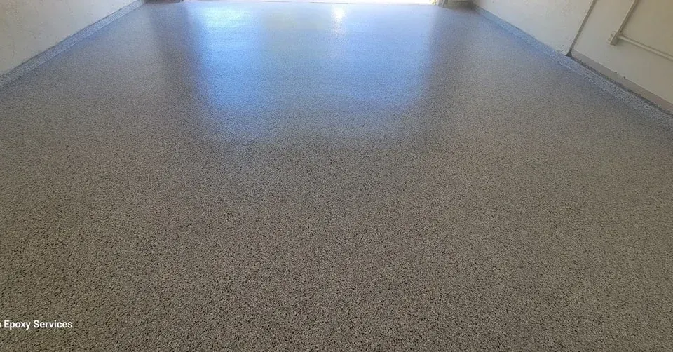 Gray speckled epoxy garage floor.