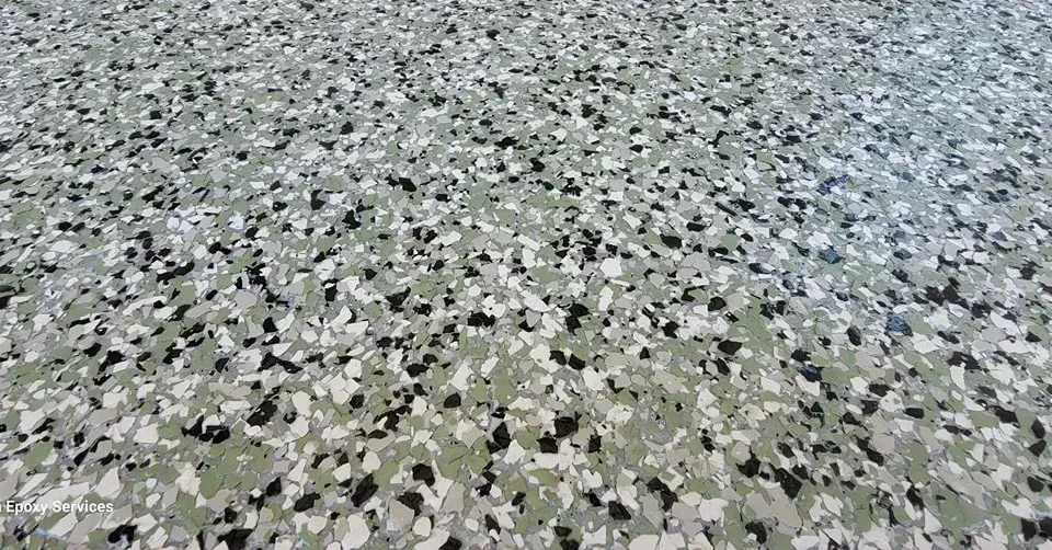 Gray and black speckled epoxy floor.