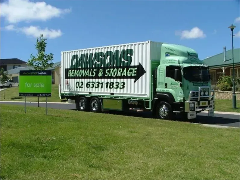 Green Moving Truck Parked on Grass — Dawson's Removals In Kelso, NSW