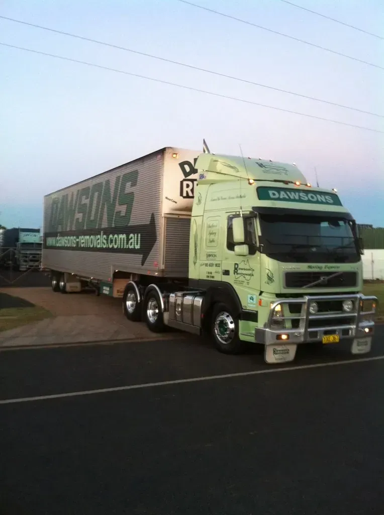 Green and White Semi-truck With Dawsons on side, parked on road — Dawson's Removals In Kelso, NSW