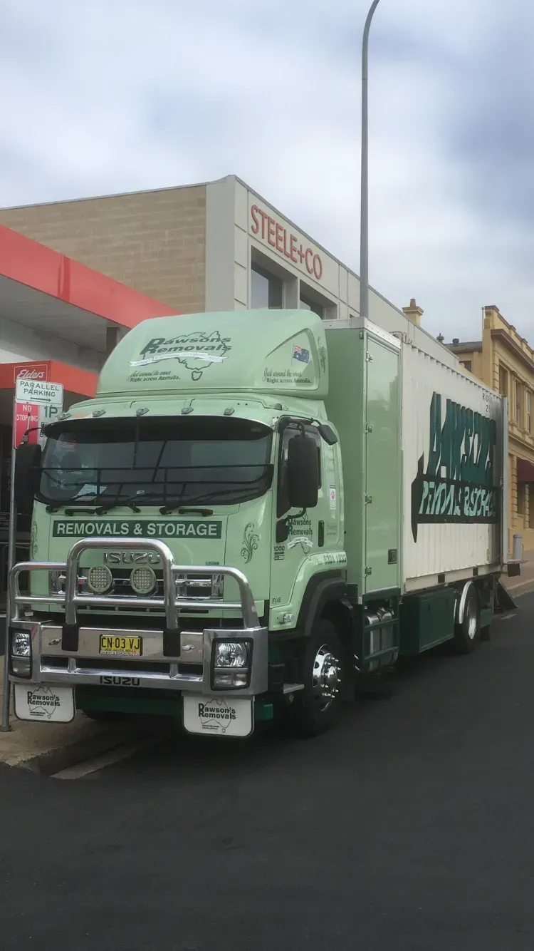 Green and White Truck Parked on a Street — Dawson's Removals In Kelso, NSW