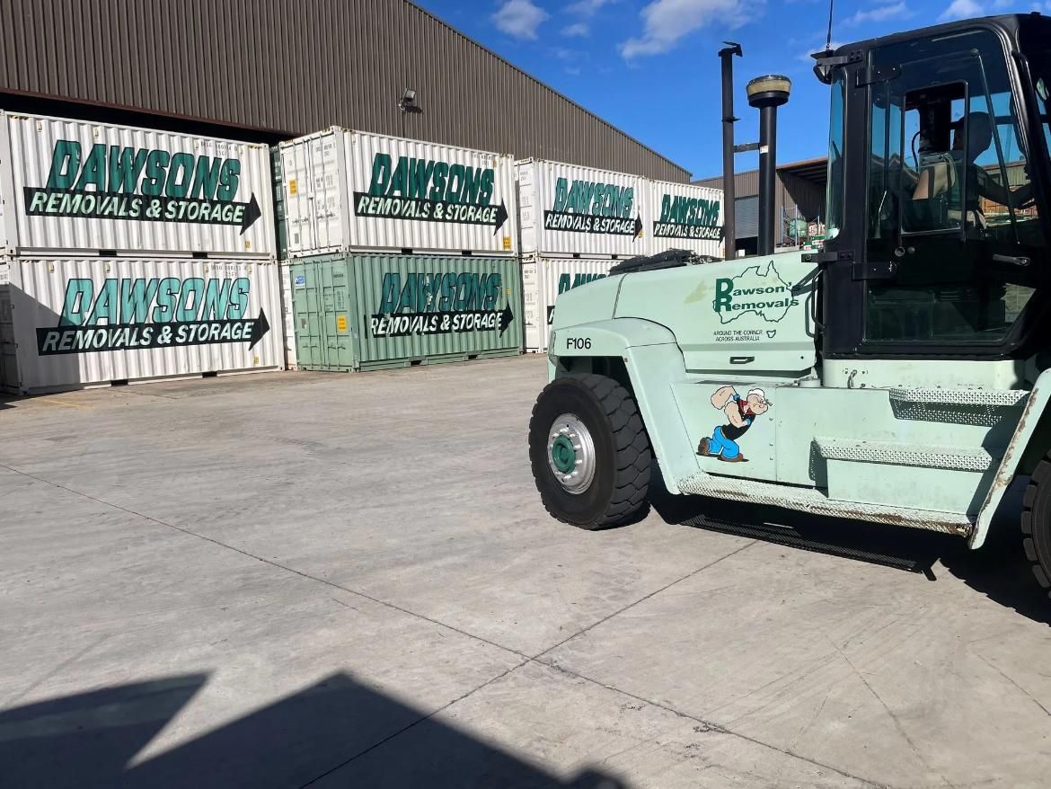 Forklift Next to Stacked Storage Containers, Both Light Green — Dawson's Removals In Kelso, NSW