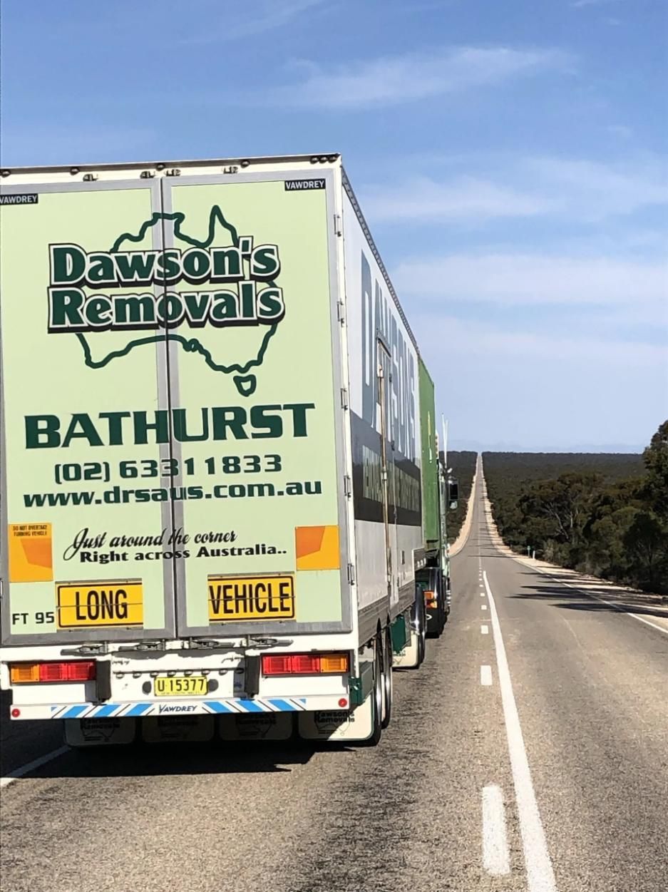 The back of a dawsons large removal truck on a straight road — Dawson's Removals In Wetherill Park, NSW