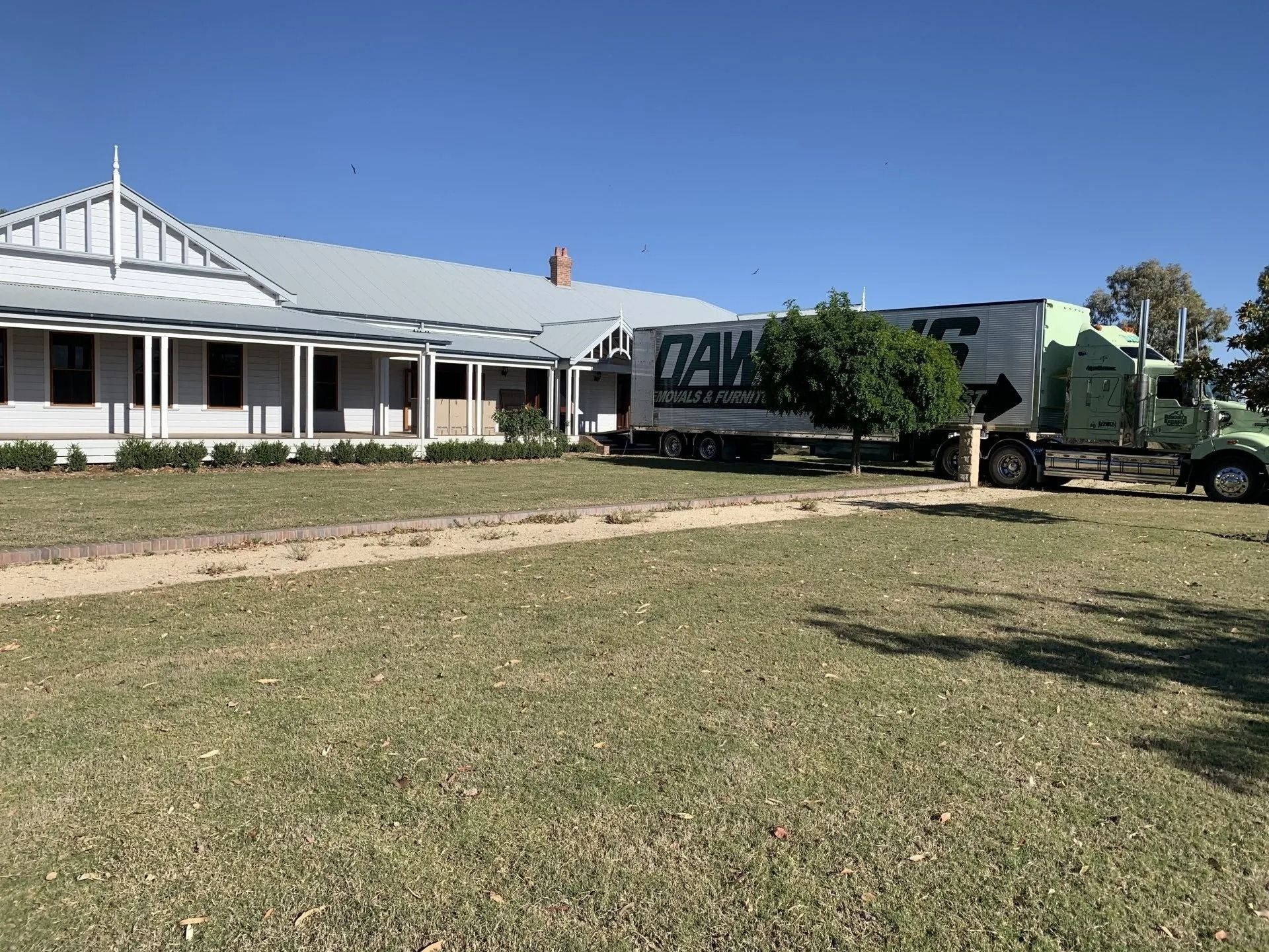 A Dawson's removal truck is reversed by a home entrance while moving homes — Dawson's Removals In Kelso, NSW