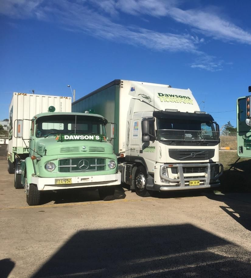 Two trucks are face front side by side — Dawson's Removals In Kelso, NSW