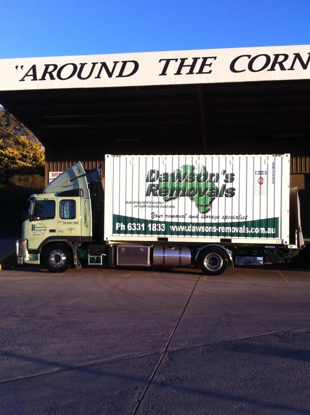 Truck From Daniels Removals Parked Under a Sign That Says Around the Corner — Dawson's Removals In Wetherill Park, NSW