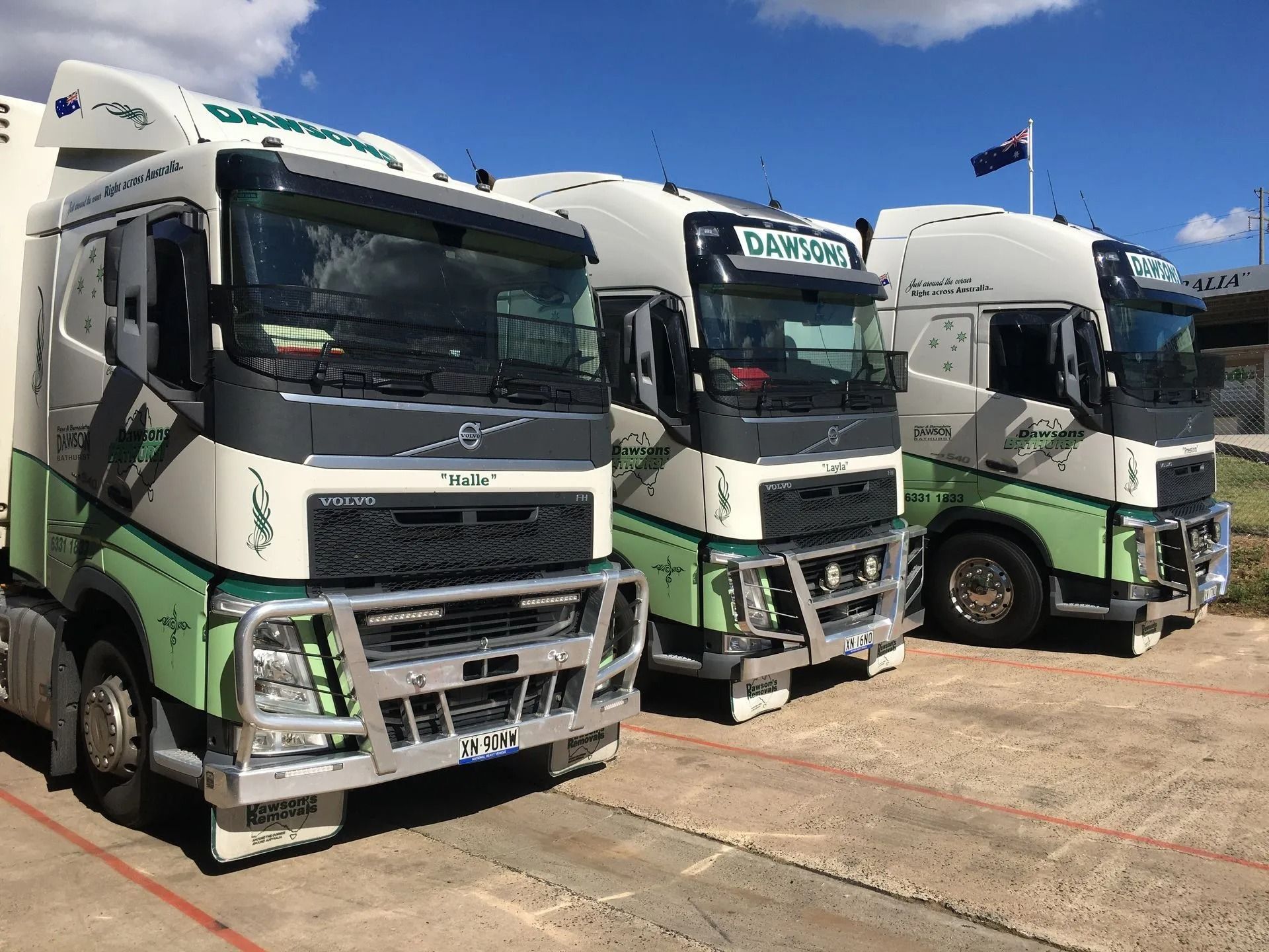 Three White and Green Semi-trucks Parked Outside — Dawson's Removals In Wetherill Park, NSW
