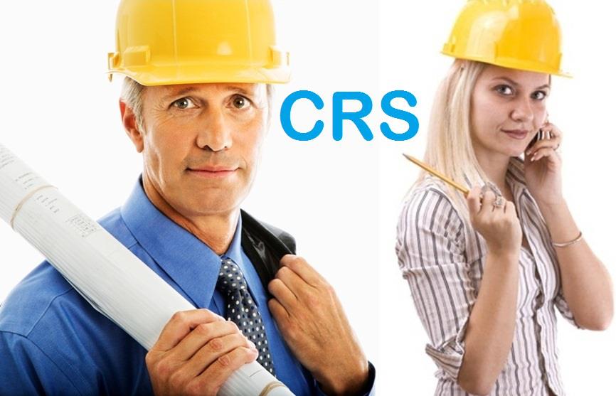 A man is holding a blueprint and a woman is talking on a cell phone.