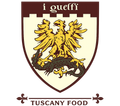 Logo di I Guelfi Tuscany Food con stemma di un'aquila dorata su sfondo bianco.