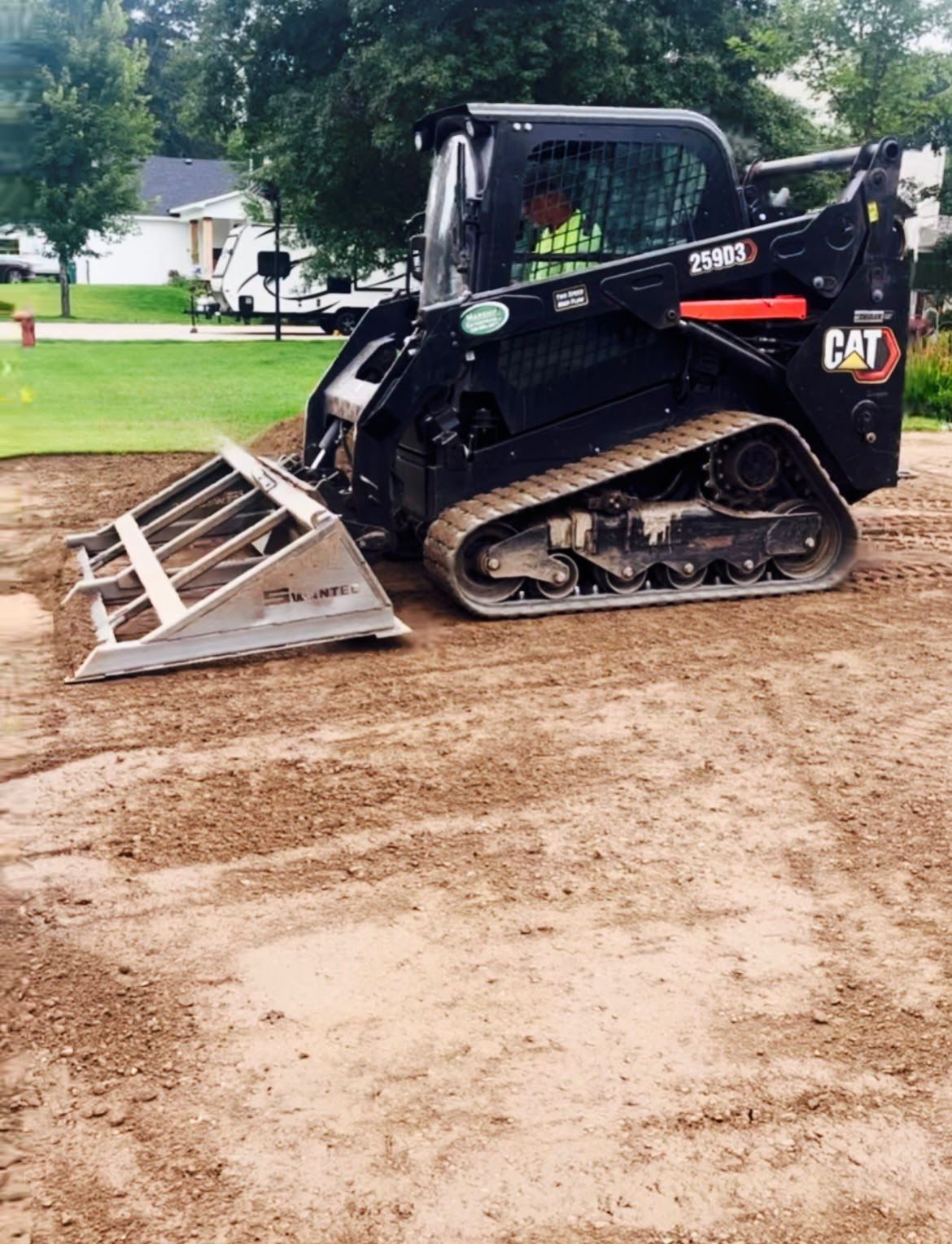 a black bulldozer on dirt
