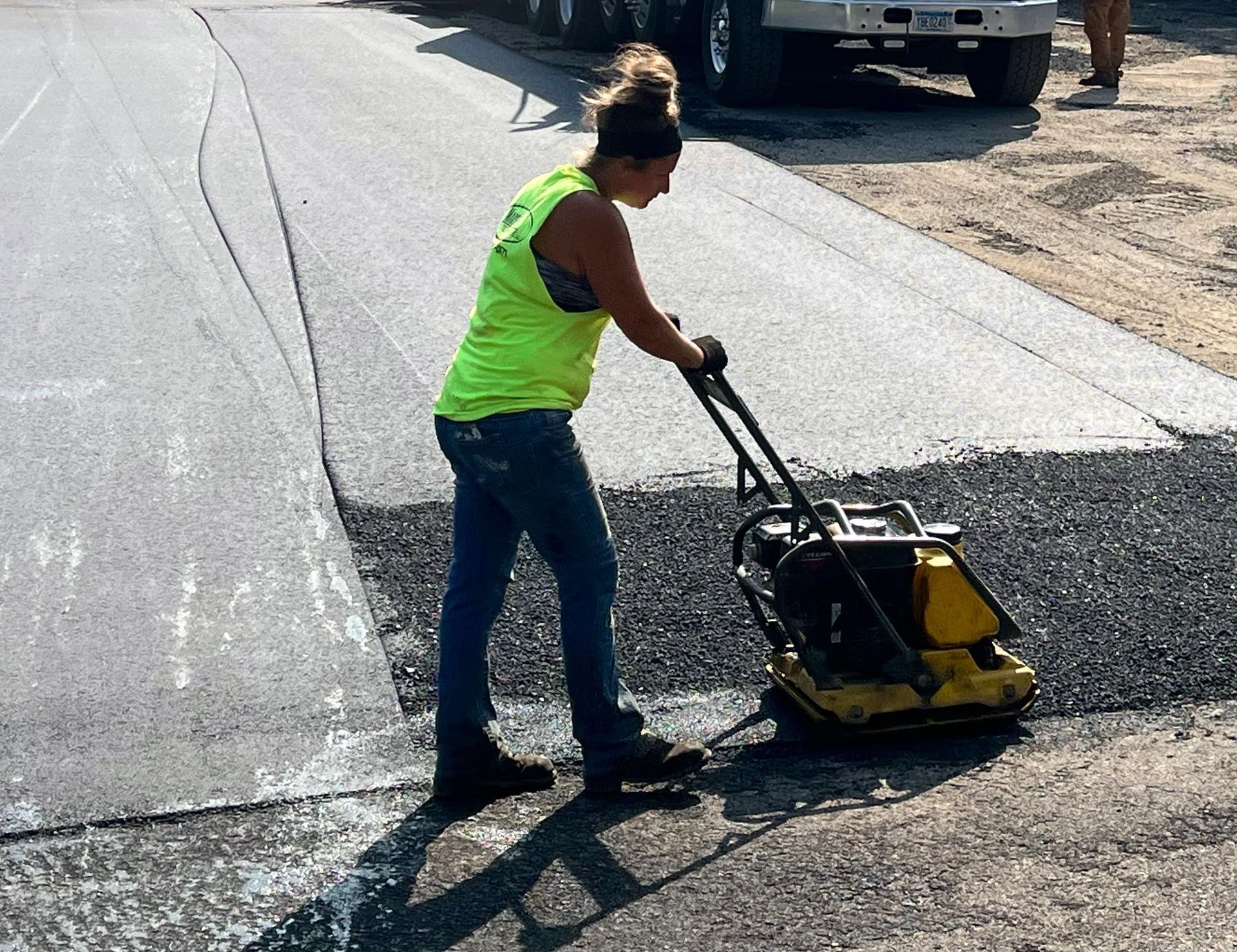worker overlaying the driveway