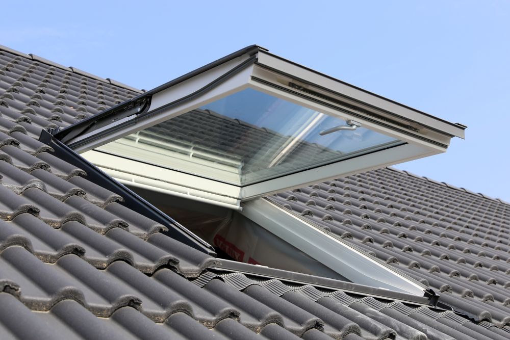 A Skylight is Open on the Roof of a House — Nathan Parnell Roofing In Ulladulla, NSW