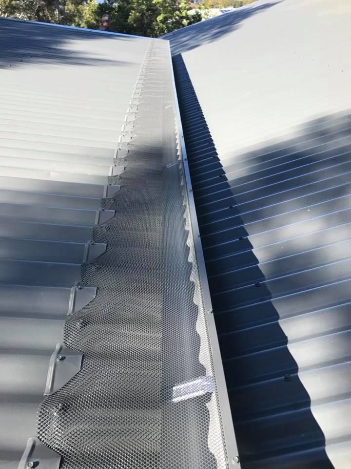 A close up of a metal gutter on a roof — Nathan Parnell Roofing In Vincentia, NSW