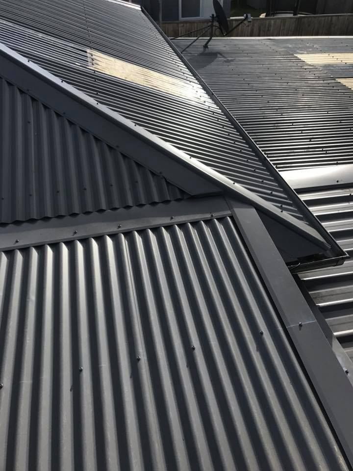 A Close Up of a Gray Corrugated Metal Roof — Nathan Parnell Roofing In Nowra, NSW