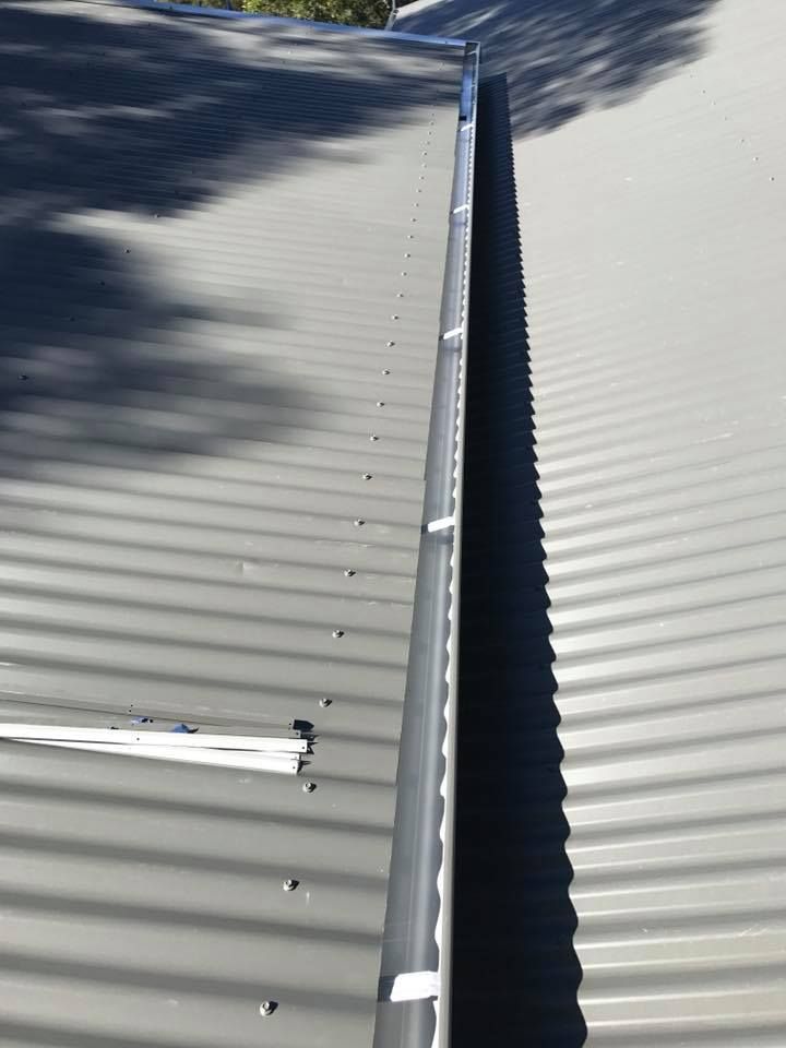 A Close Up of a Gutter on a Roof  — Nathan Parnell Roofing In Culburra, NSW