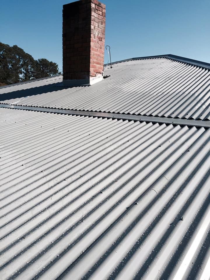 A Roof With a Chimney on Top of It — Nathan Parnell Roofing In Vincentia, NSW