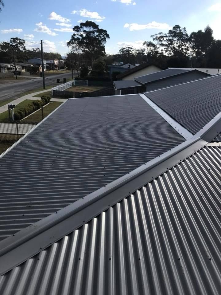 A Close Up of a Roof With a Blue Sky in the Background — Nathan Parnell Roofing In Vincentia, NSW