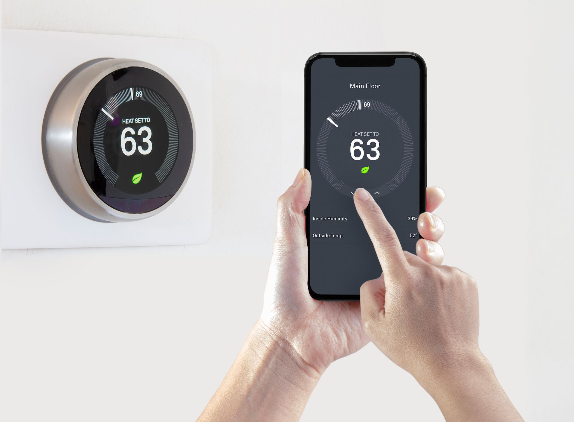 Round thermostat showing 63° beside a smartphone controlling the same temperature