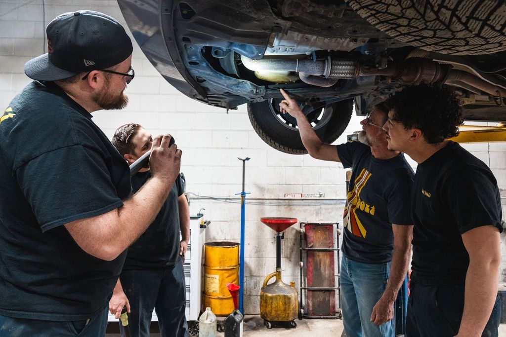 Mechanics Working in an Auto Repair Shop | AutoSport