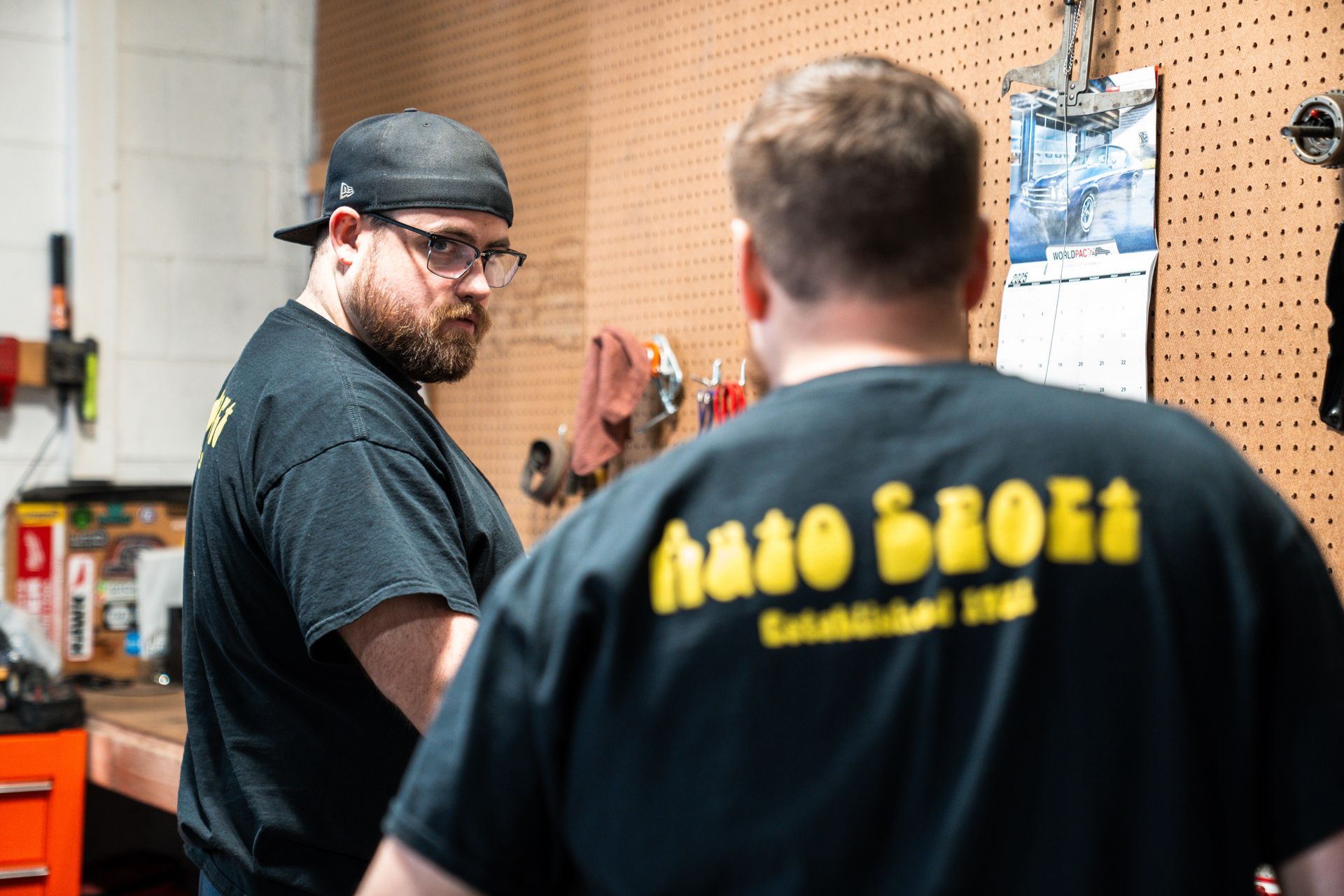 Two Men in a Workshop Environment | AutoSport