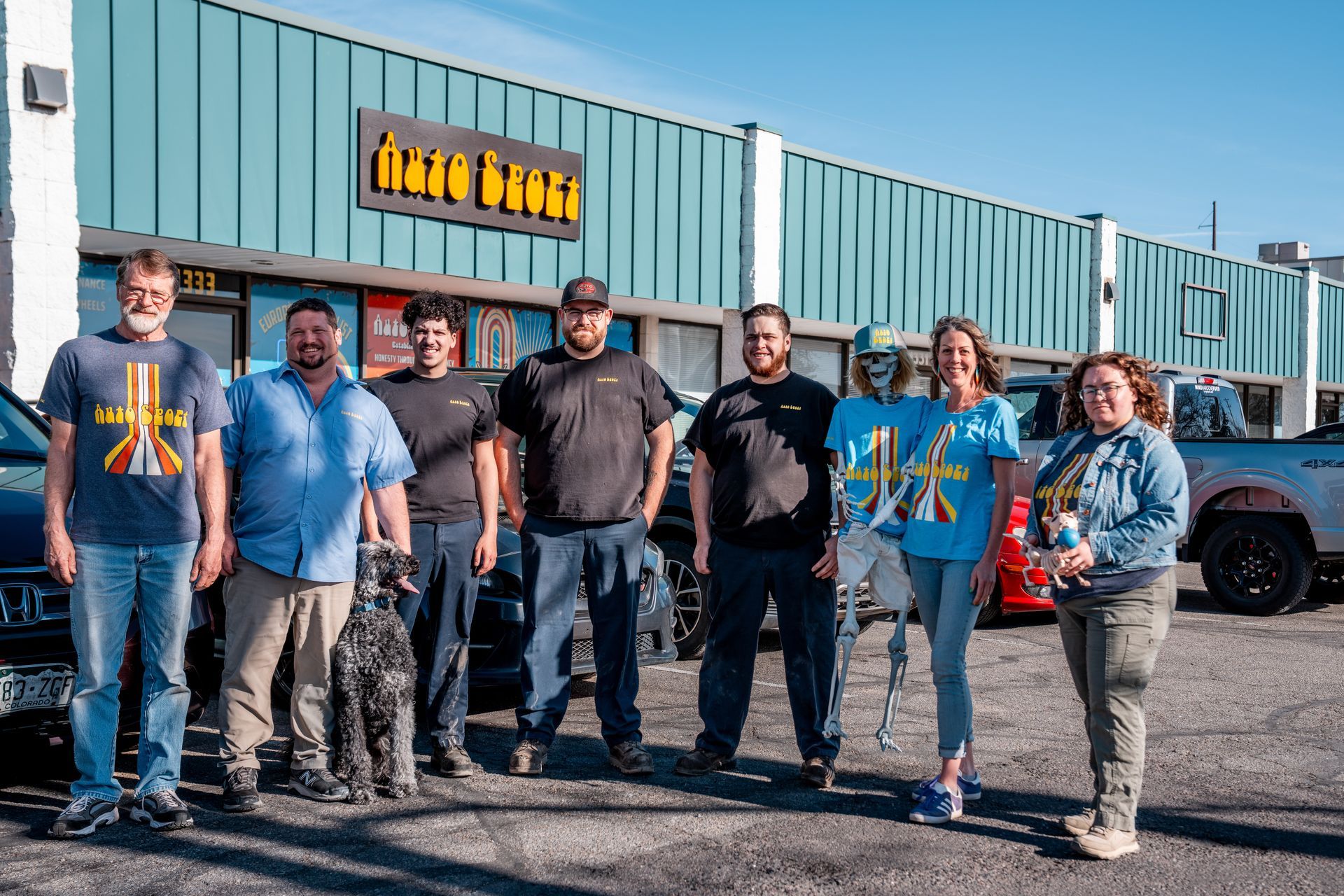 Group of People Standing Outside the Shop | AutoSport