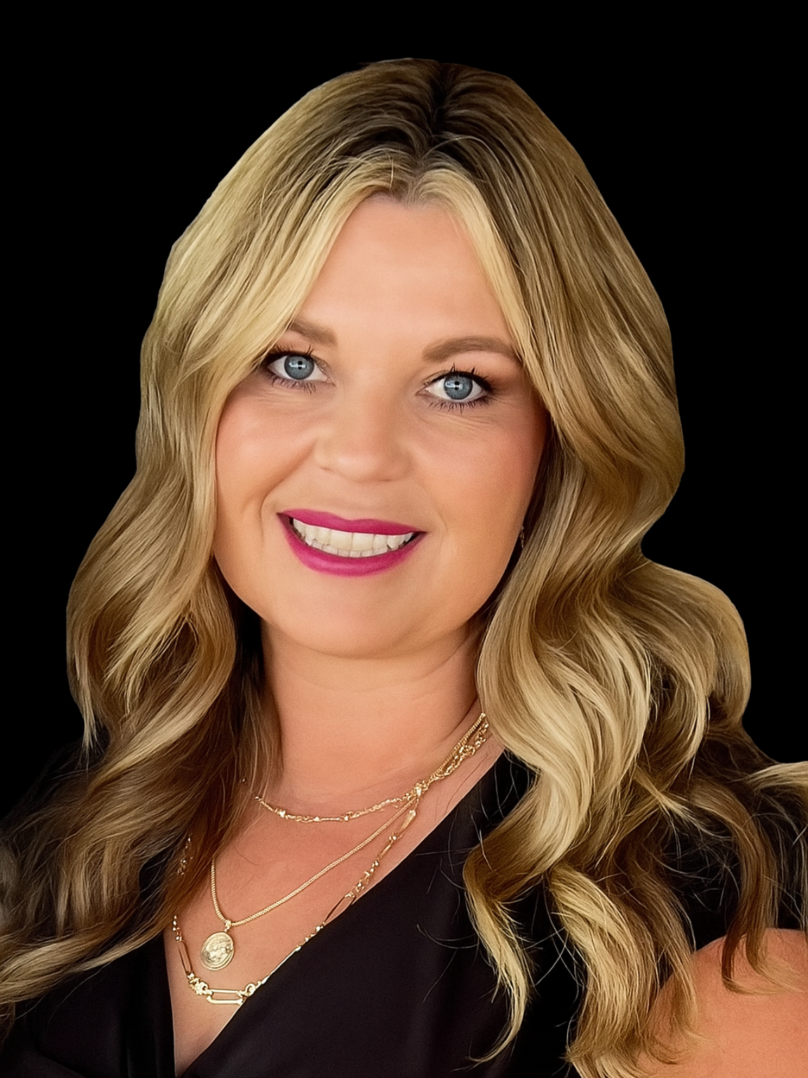 Smiling woman in a white coat with pearl necklace against a dark background