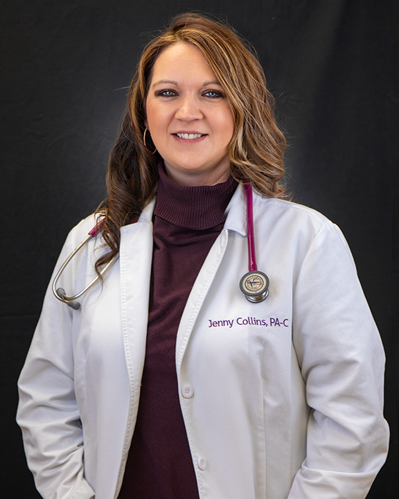 Female doctor in white coat with stethoscope, smiling against a dark background.
