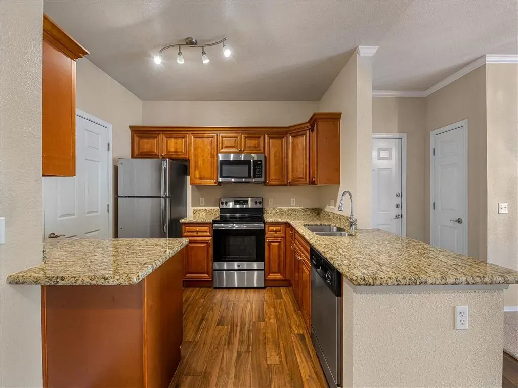 Kitchen with granite countertops and stainless steel appliances