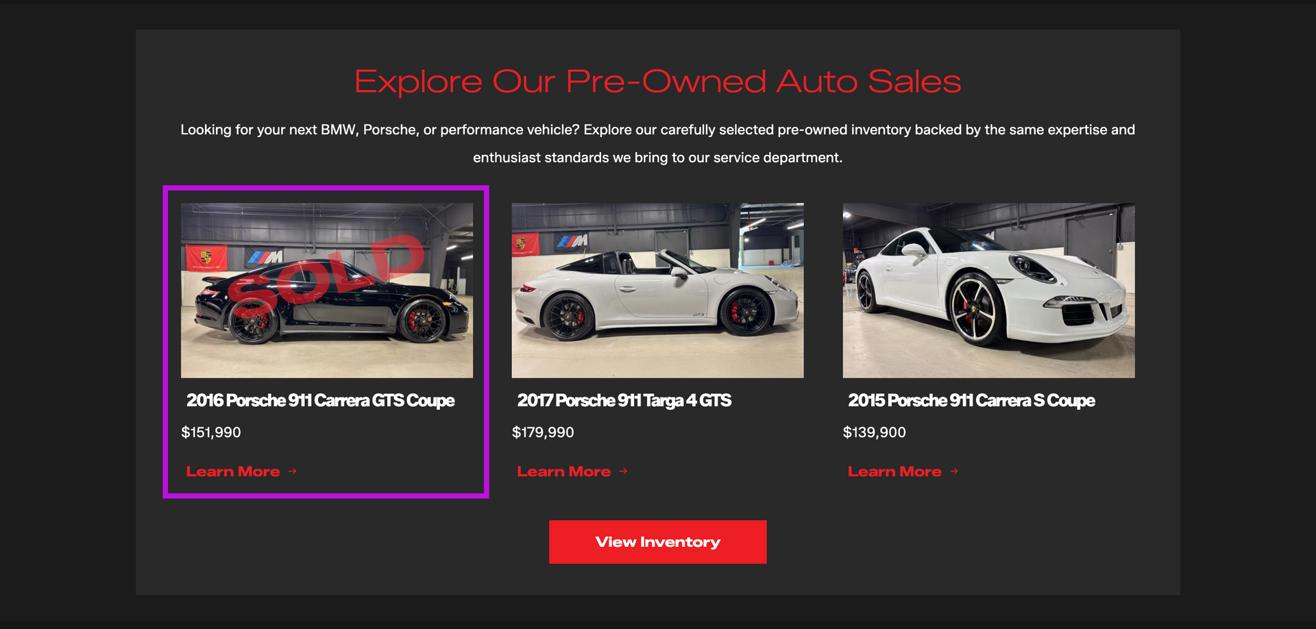 Dark-themed car gallery page with three vehicle cards and a red “Load More” button