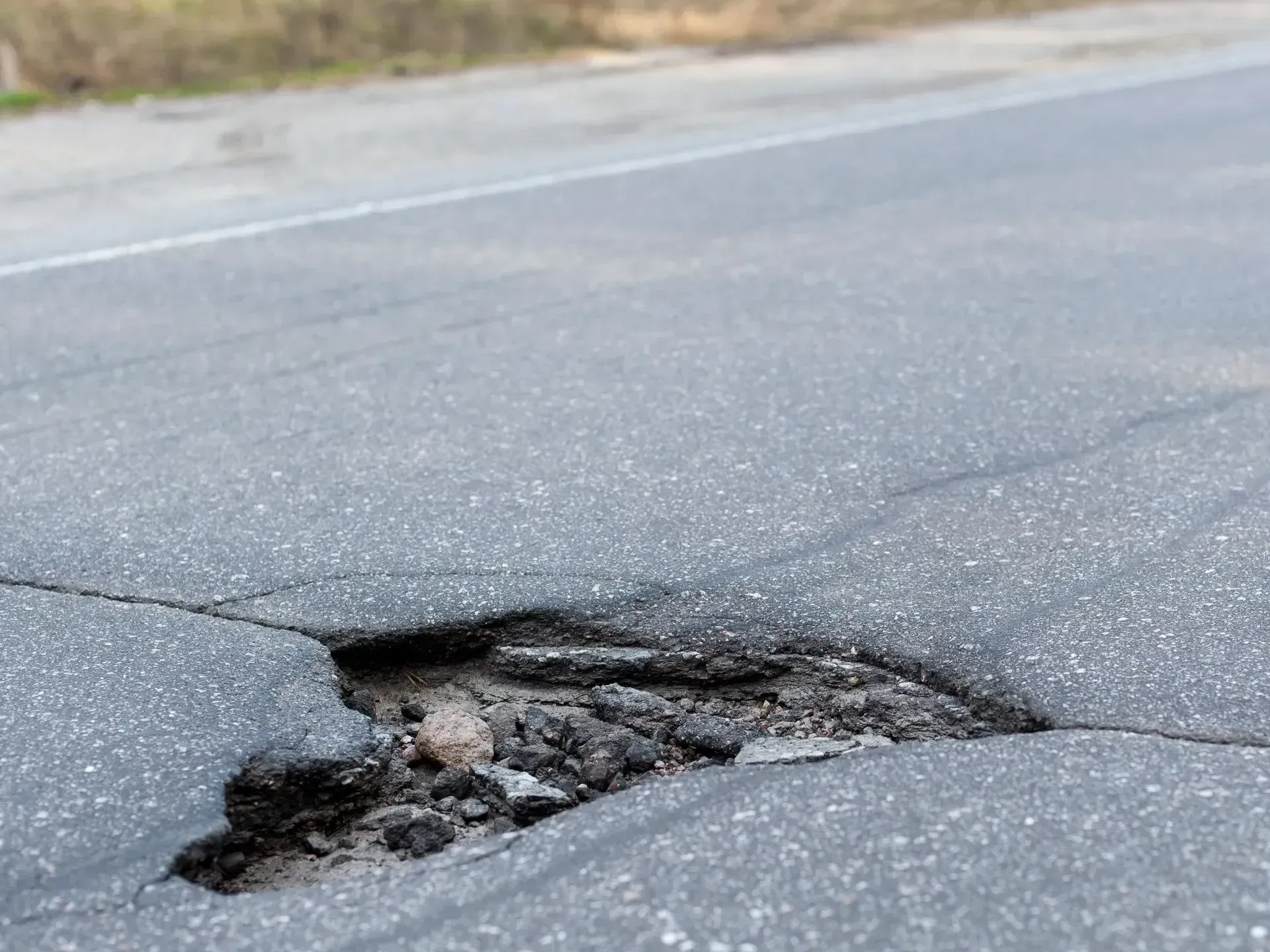 There is a hole in the middle of the road.