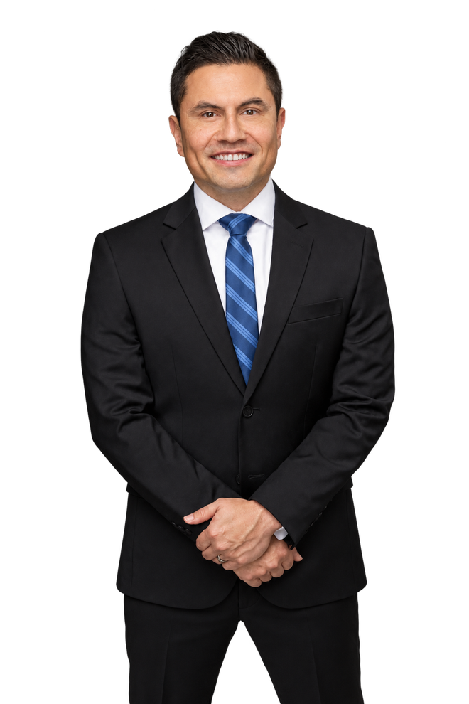 Octavio Duran wearing a black suit and blue striped tie.
