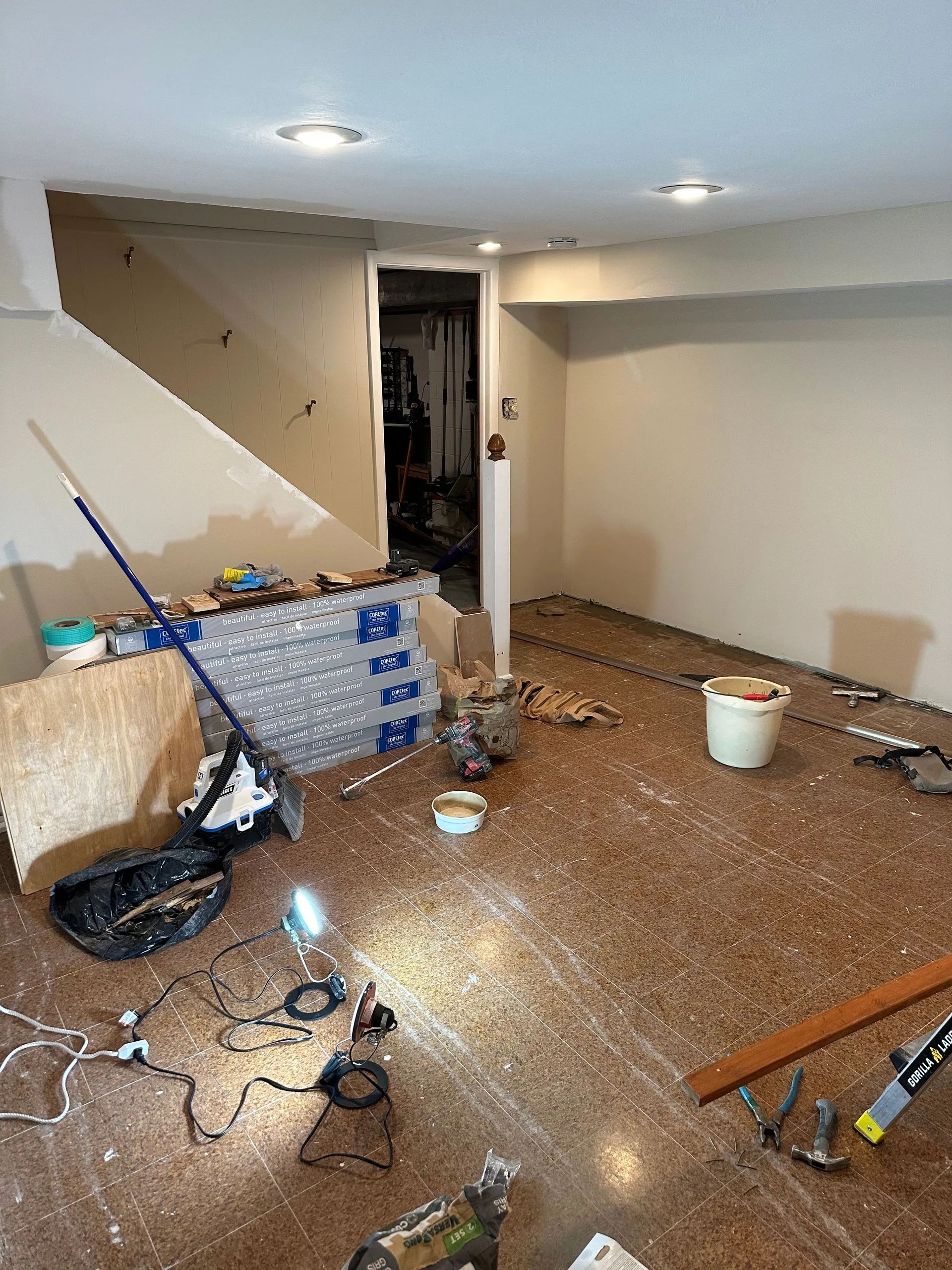 A room that is being remodeled with a lot of tools on the floor.
