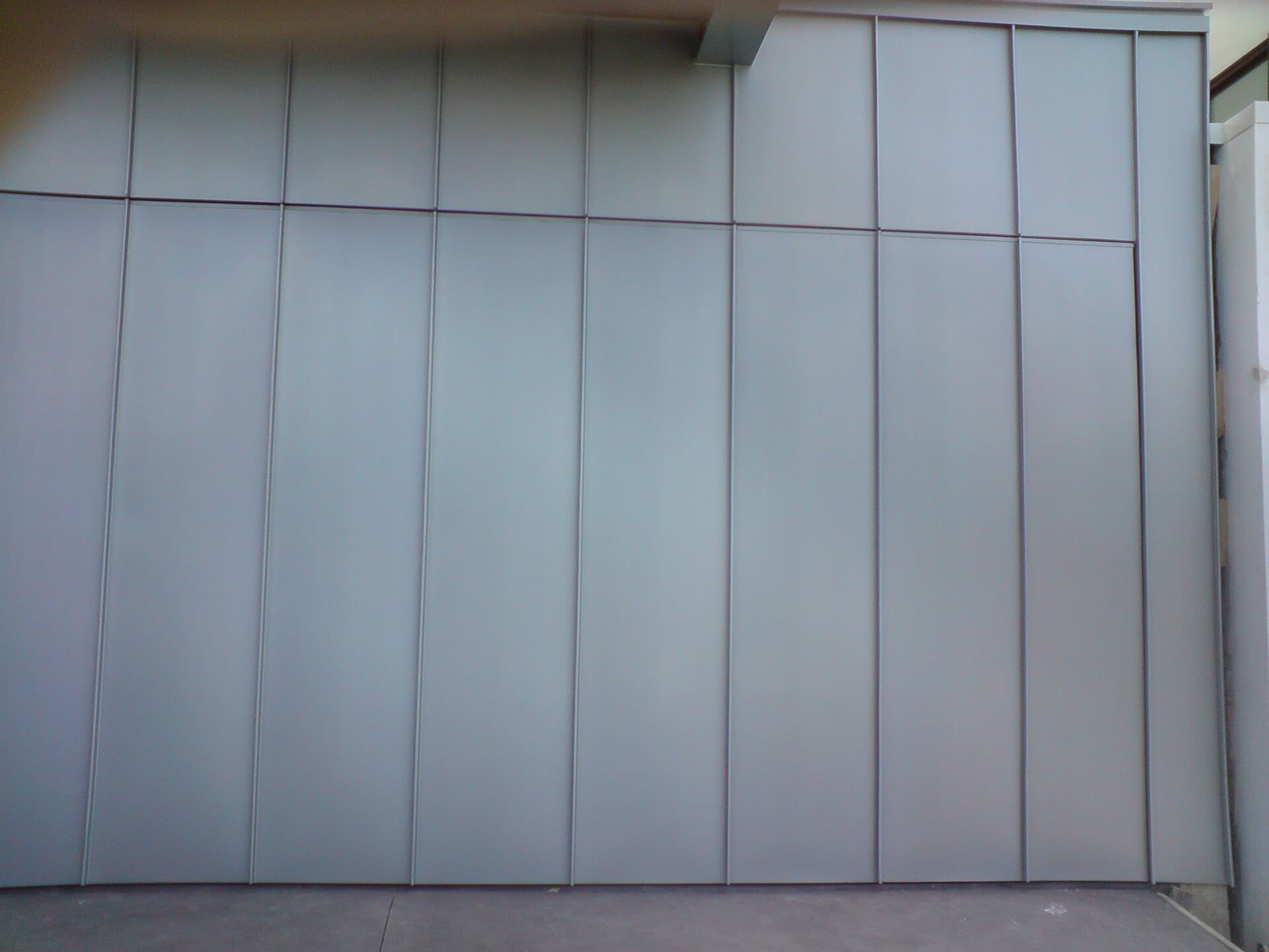 Angle Standing Seam Garage Door & Wall Cladding