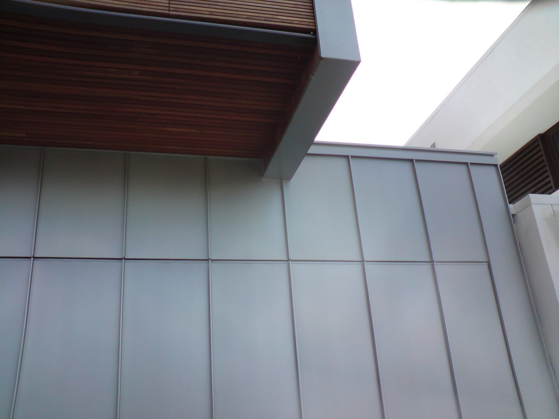 Angle Standing Seam Garage Door & Wall Cladding