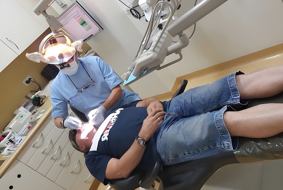 Patient Receiving Gentle Dental Care From A Dentist In Moss Vale