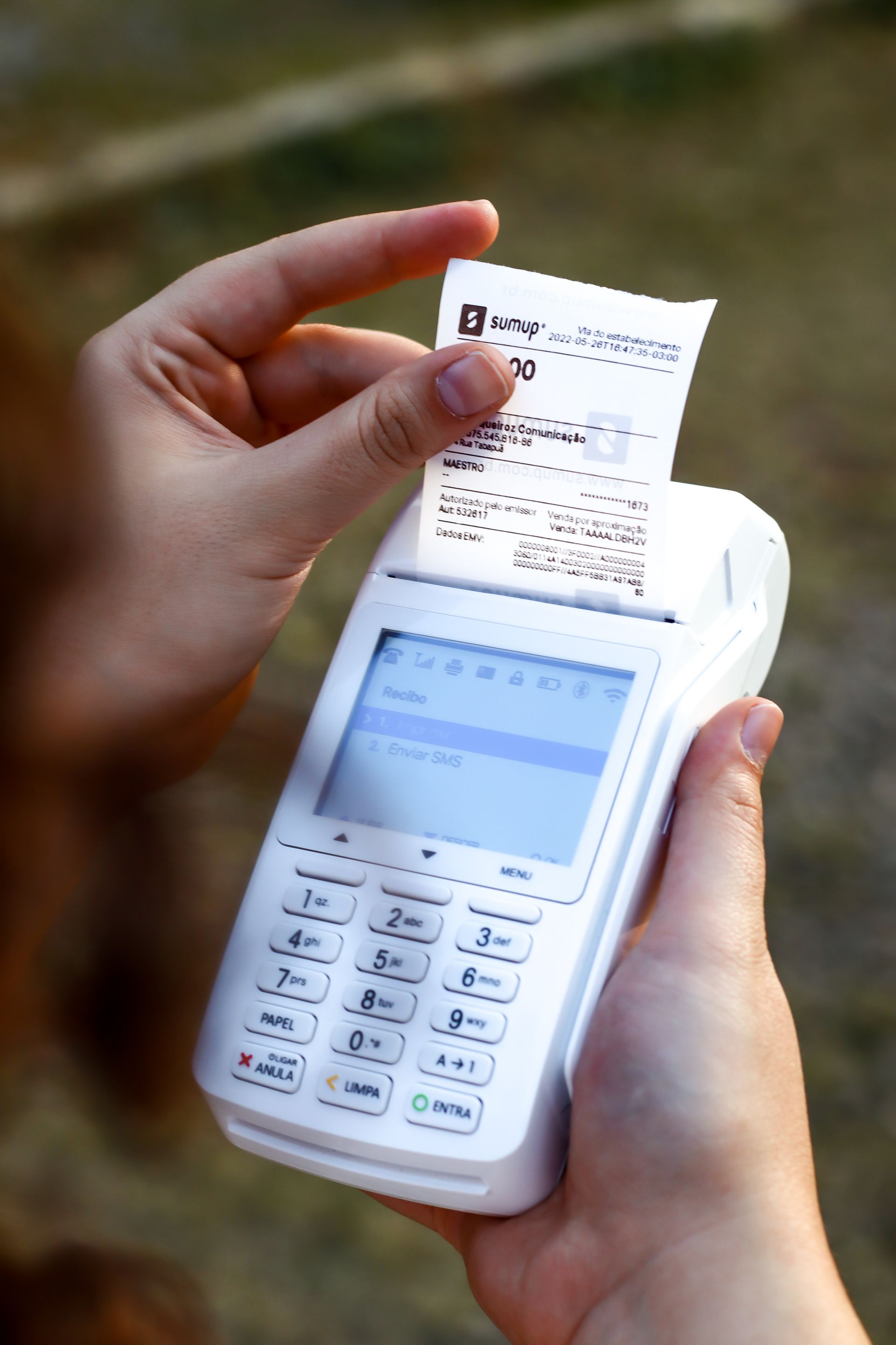 Hand holding EFTPOS receipt