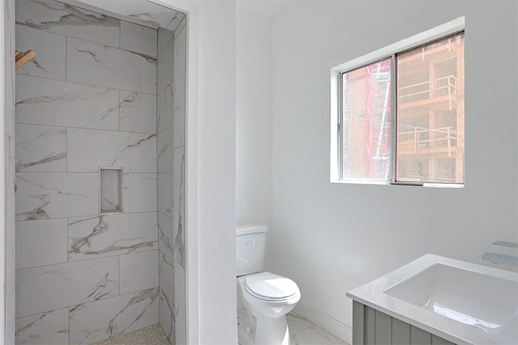 Manhattan Place Bathroom Photo With Cozy Toilet