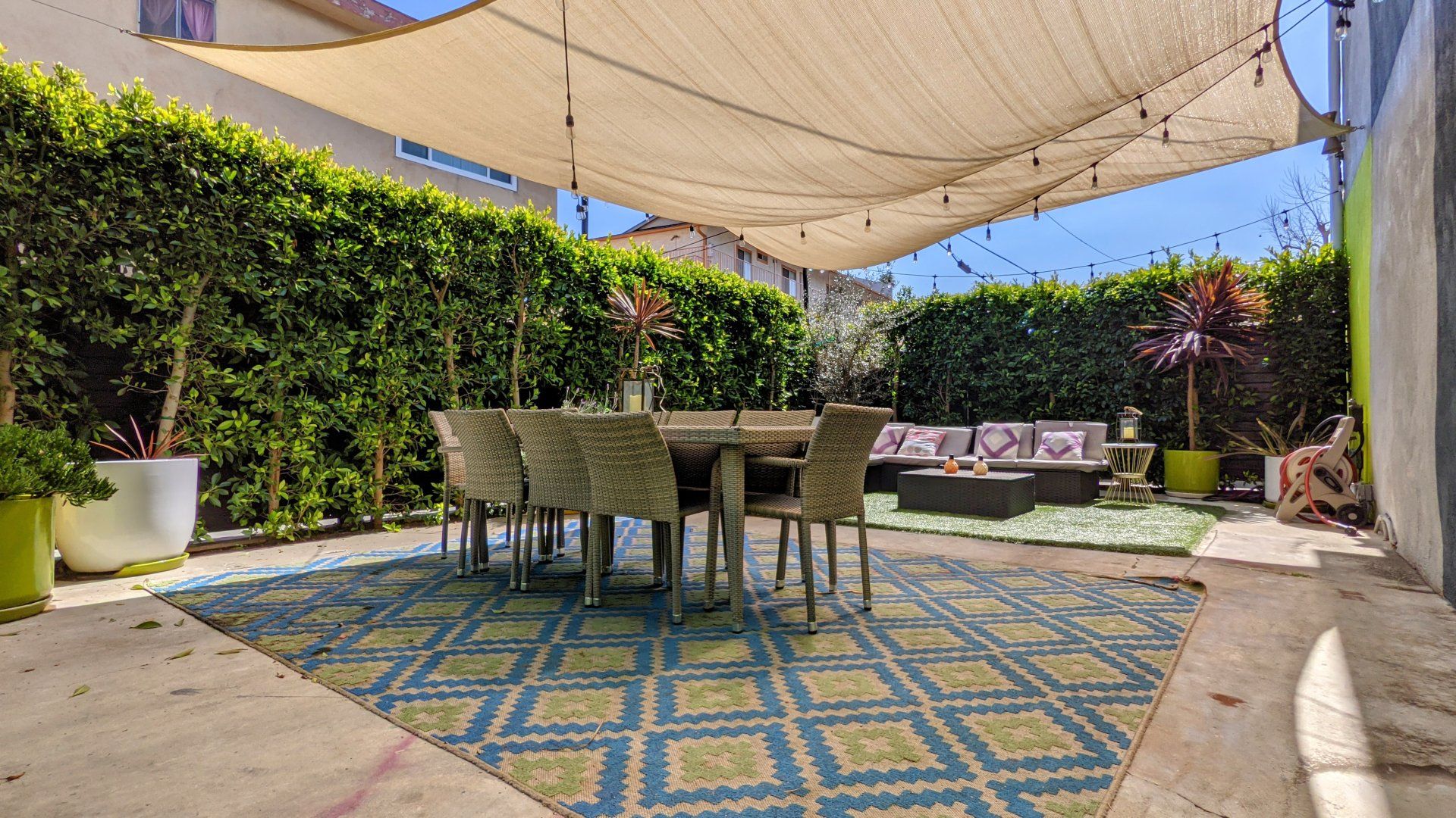 Market Street Outdoor Lounge With Shade, Chairs and Table Photo